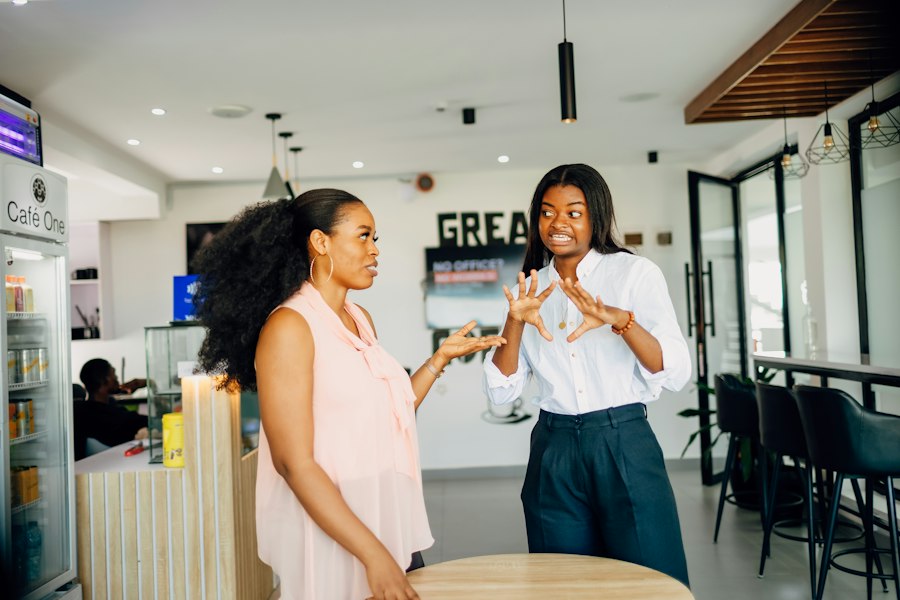 Two women in a lively professional conversation